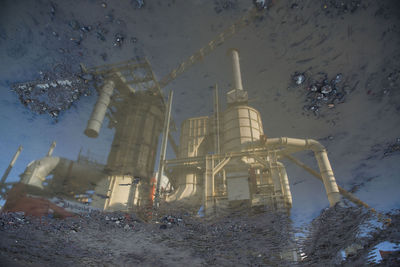 The power plant reflected in water
