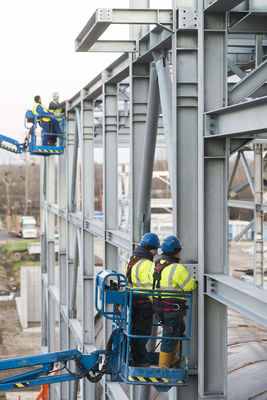 Workers checking the quality of the steel construction